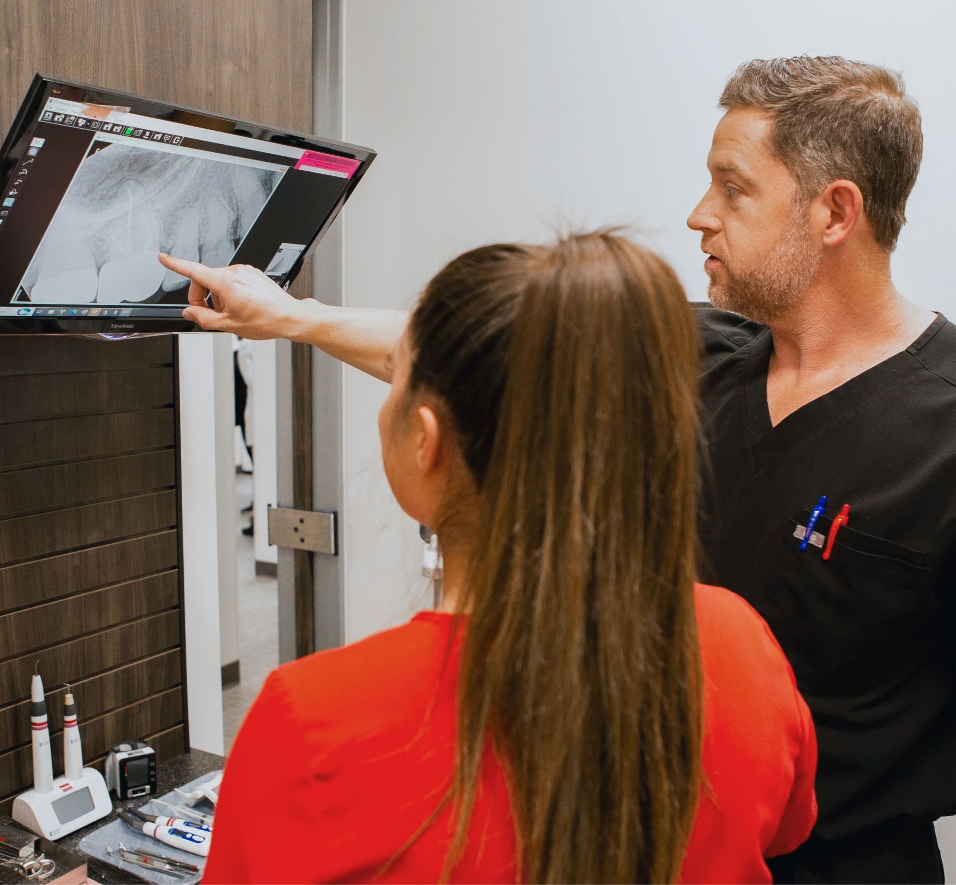 Dr. Randy Middleton reviewing a dental X-ray with an EndoConnect team member